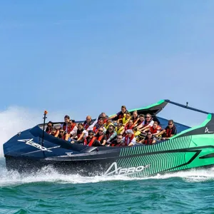 Guests on black and green Arro Jet Boat.