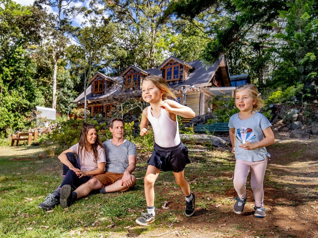 Family enjoying the front lawn of Groom's Cottage