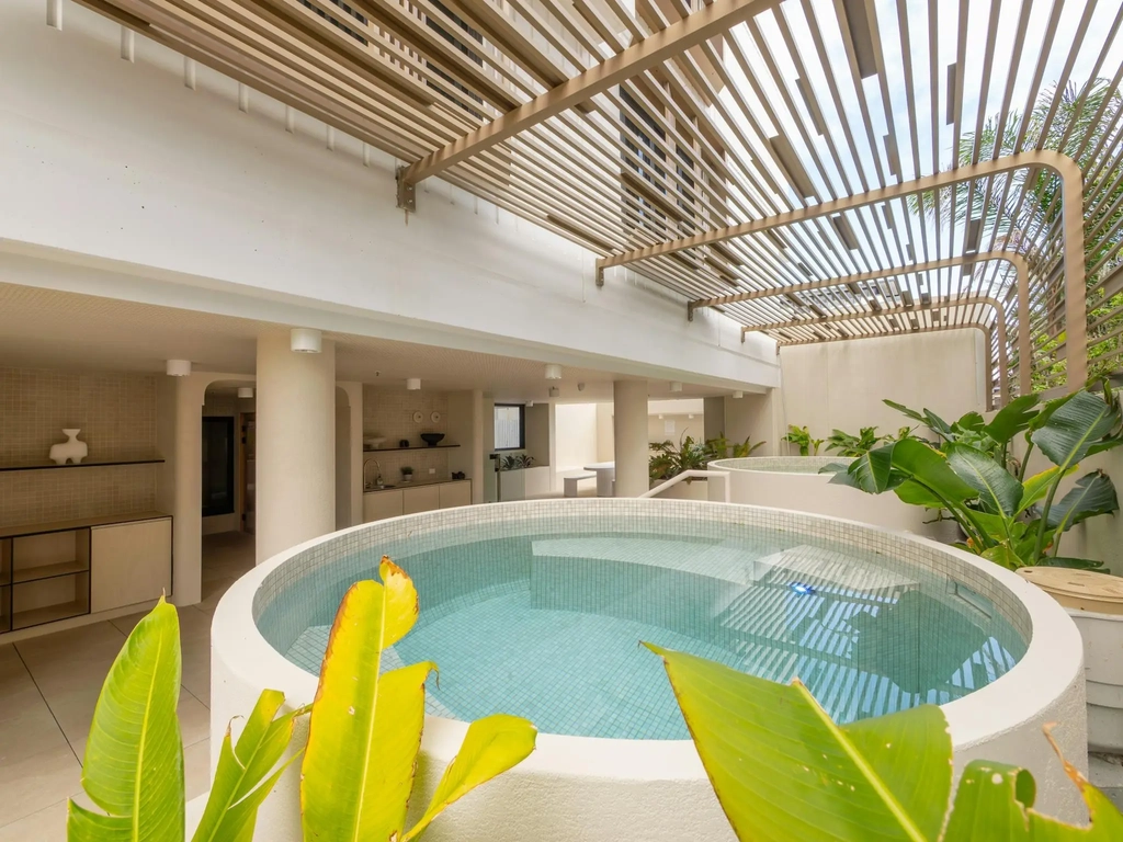 Round magnesium plunge pools under a timber pergola
