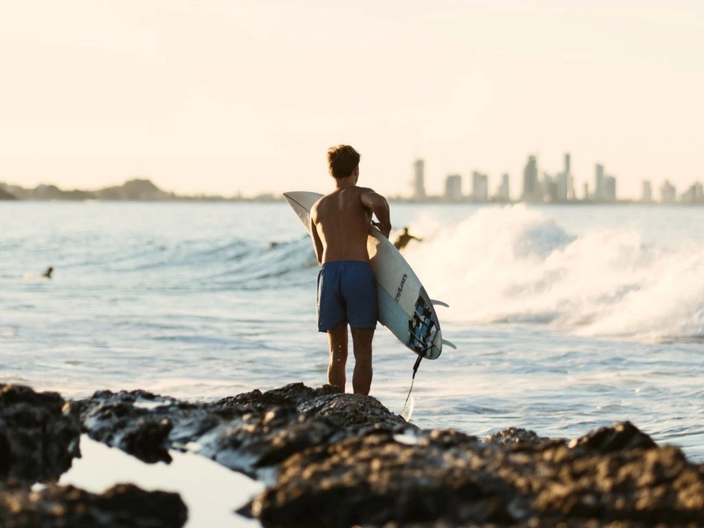 Surfer with Gold Coast Skyline in Background