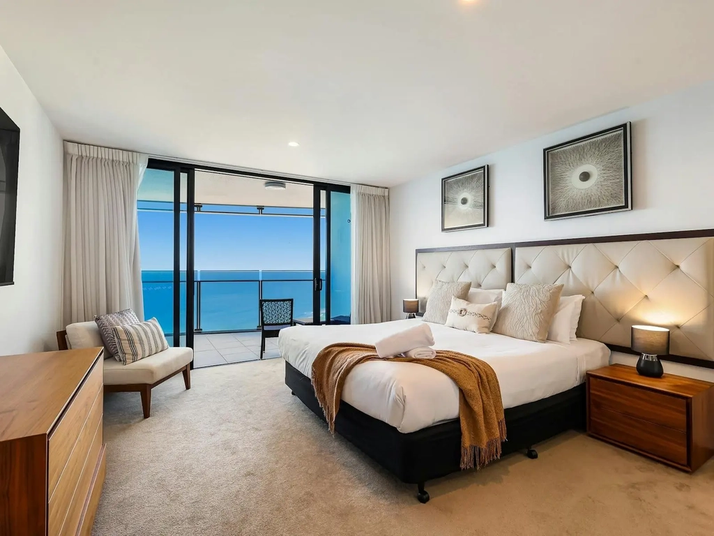 Second bedroom with King bed, balcony access with ocean view, ensuite with bath tub, granite finish
