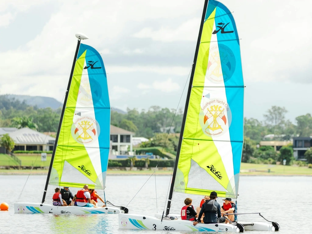 2 Sail Boats on the lake with families