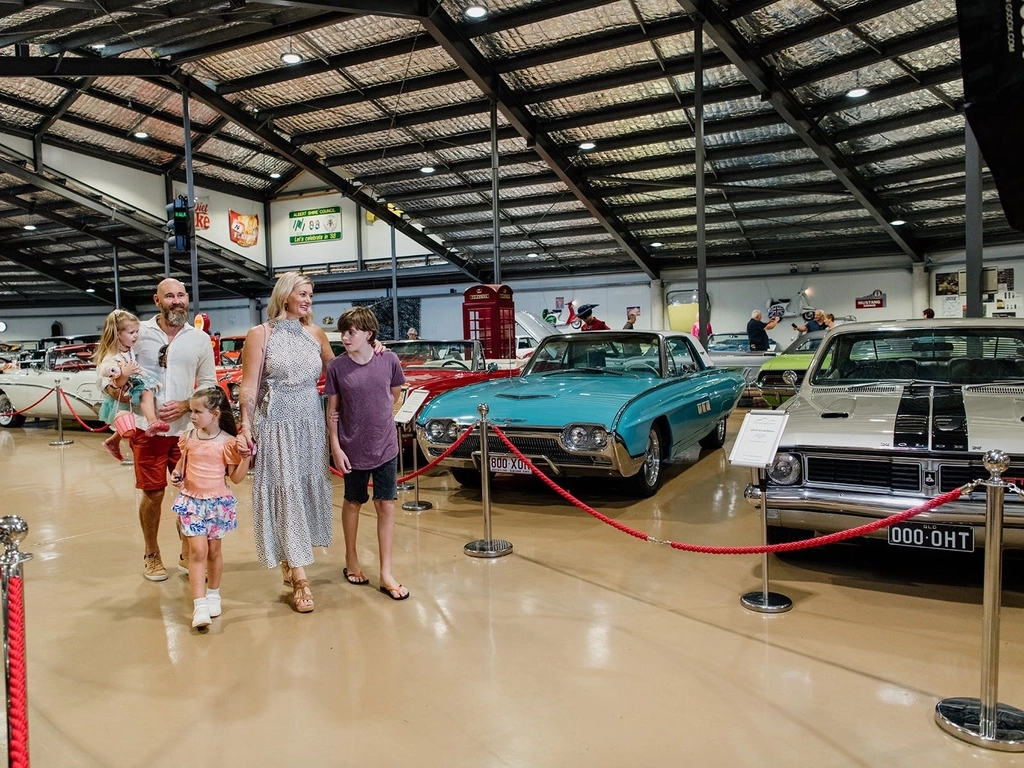 Family walks through Gold Coast Motor Museum