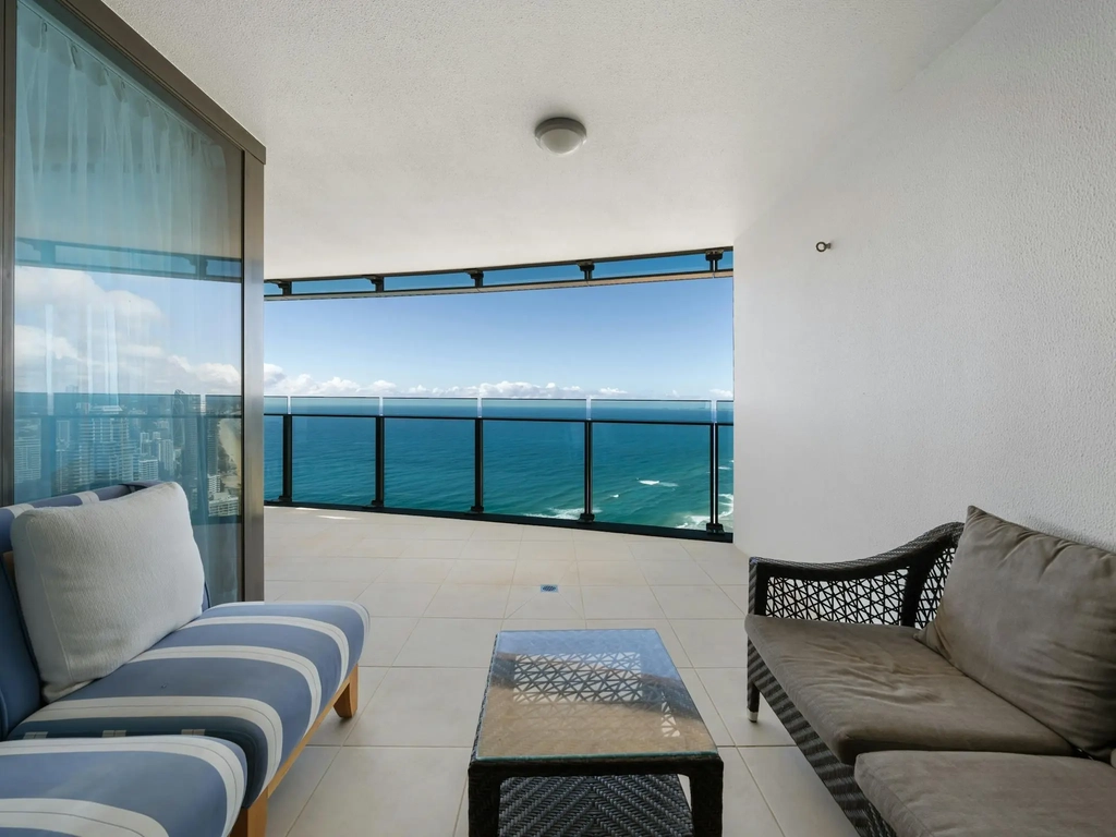 Lounge seating on the balcony of a high-rise apartment at Surfers Paradise
