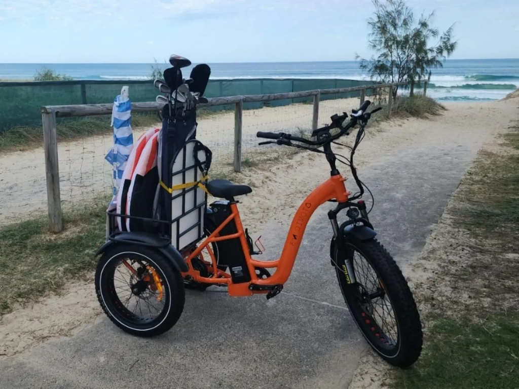 California Cruiser E-Trike loaded with beach gear and golf clubs, parked near Broadbeach.