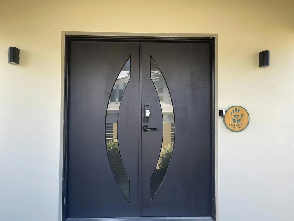 Heal Young Massage clinic entrance with timber logo sign, Varsity Lakes