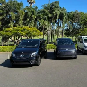 GEC Transfers fleet featuring Mercedes-Benz, Hyundai Staria, and Volkswagen vans lined up outdoors.