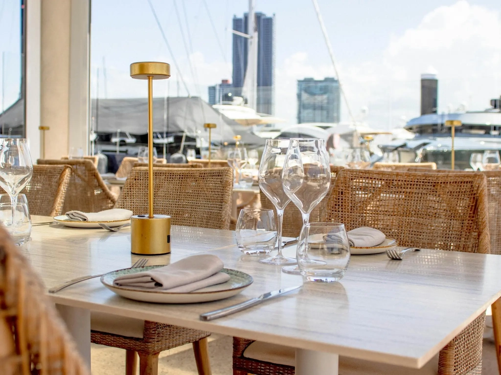 Restaurant dining at MĀRE overlooking yachts at Marina Mirage