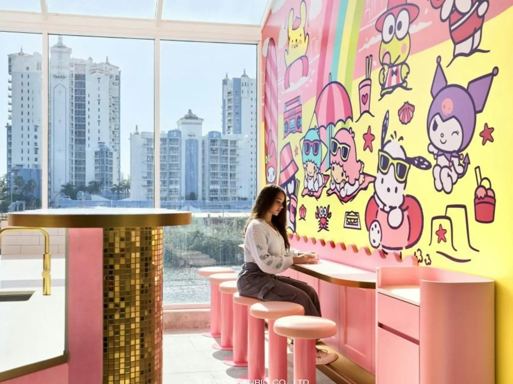 Customers at a pink service counter with Sanrio characters in the background.