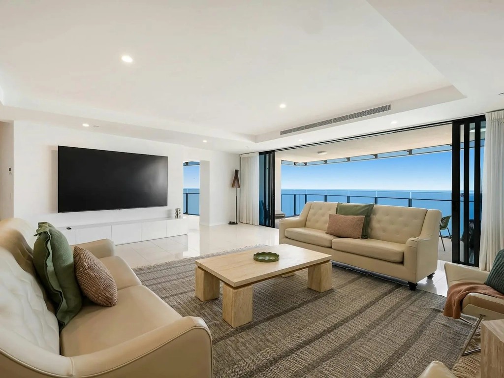 Main living room with ocean views, huge smart tv and balcony - Gold Coast Holidays Soul Peppers