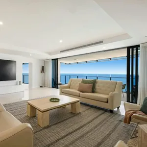 Main living room with ocean views, huge smart tv and balcony - Gold Coast Holidays Soul Peppers