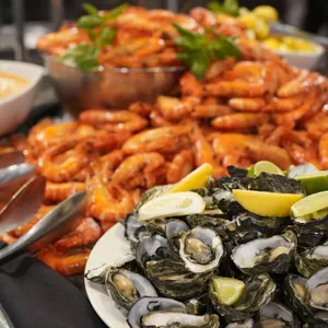 An image showing fresh oysters & prawns at the buffet