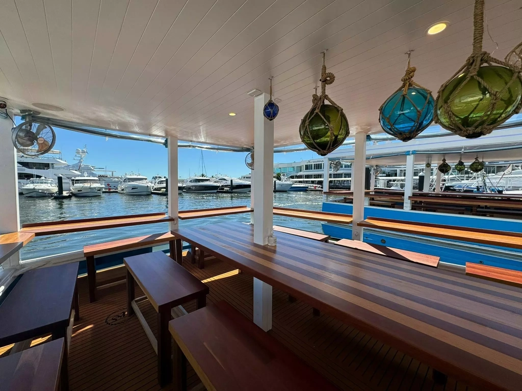 The timber seating area on a trawler turned into a restaurant
