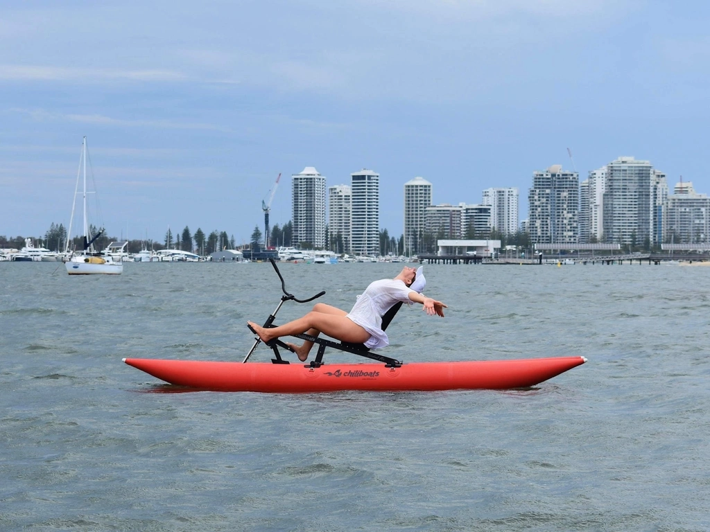 Woman reclining on waterbike.