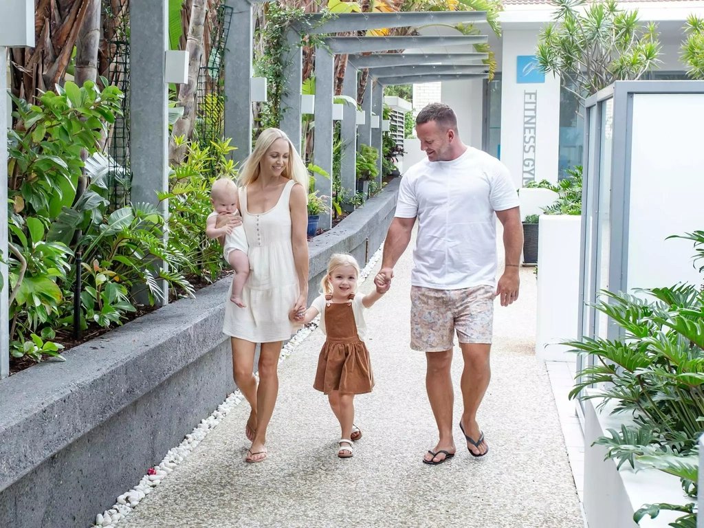 Family walking through the gardens