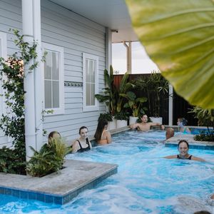 Soak and connect with friends in the outdoor hot mineral pool at Soak Bathhouse Mermaid Beach