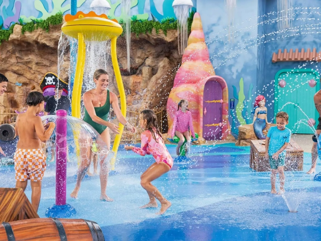 Family playing in splash zone