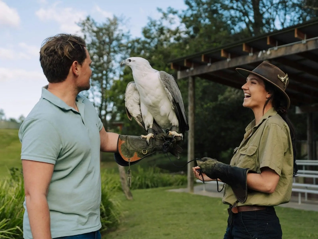 Guest participating in Raptor Encounter