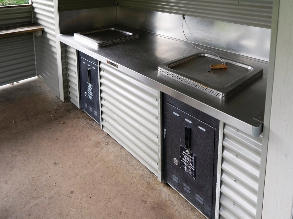 Two BBQs in cooking shelter.