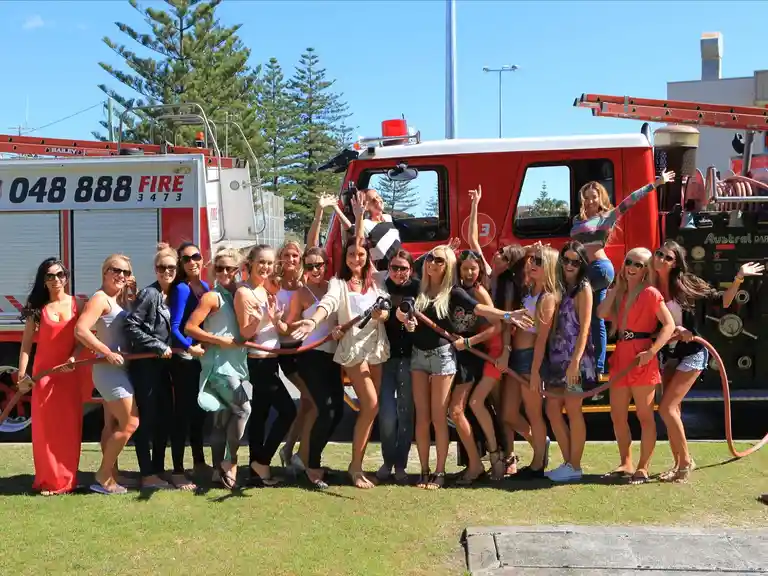 Ladies enjoying a fun Fire Truck Transfers service to their event
