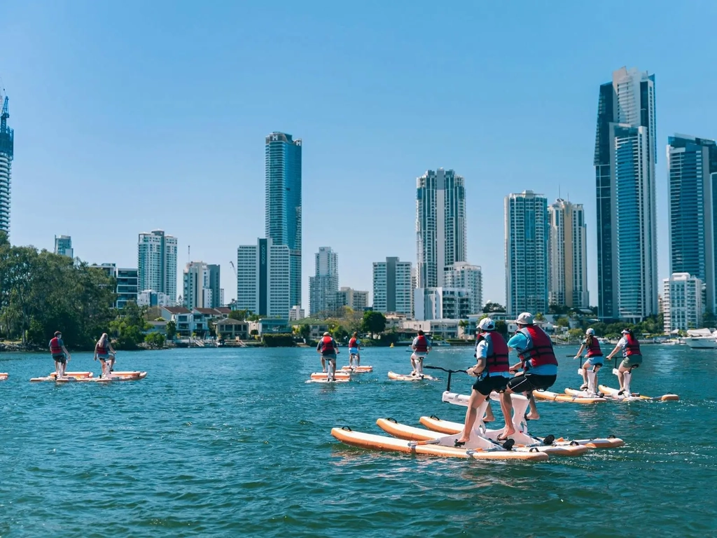 Paradise Waterbikes Group pedalling on the water with Surfers Paradise skyline