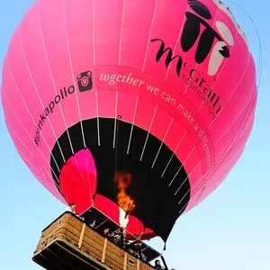 Giant Pink Hot Air Balloon rising up into the Air