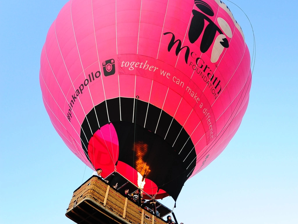 Giant Pink Hot Air Balloon rising up into the Air