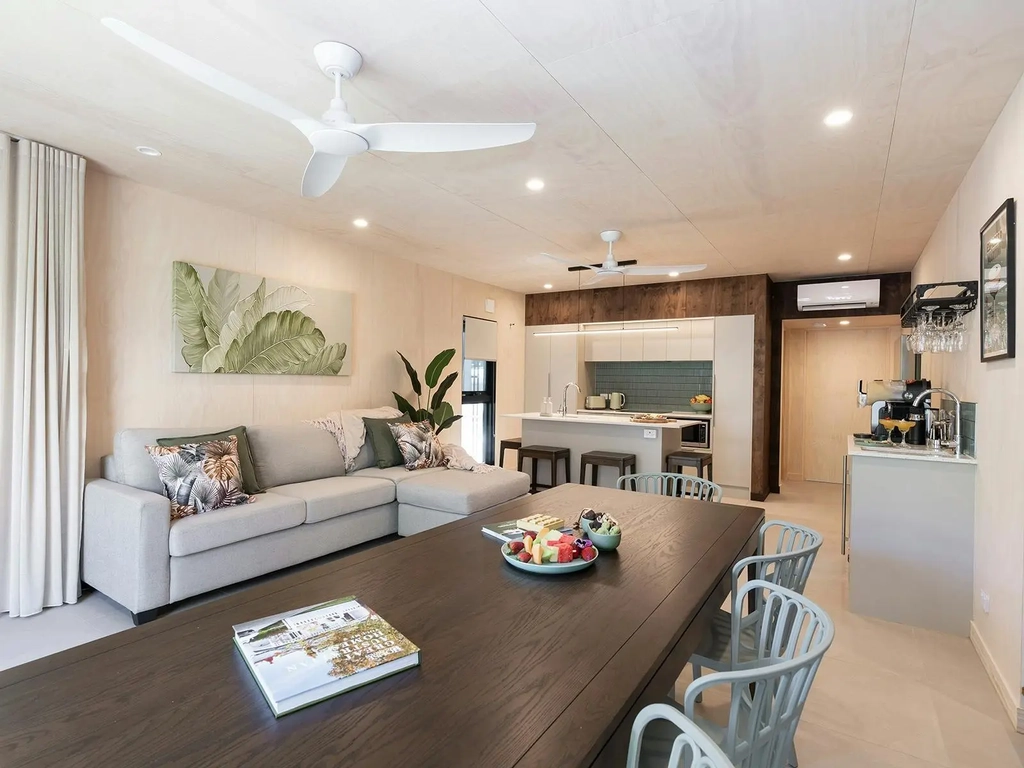 The interior of a stylish lounge, dining and kitchen area