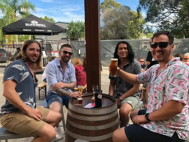 Kicking back in the sun with cold beers at Burleigh Brewing