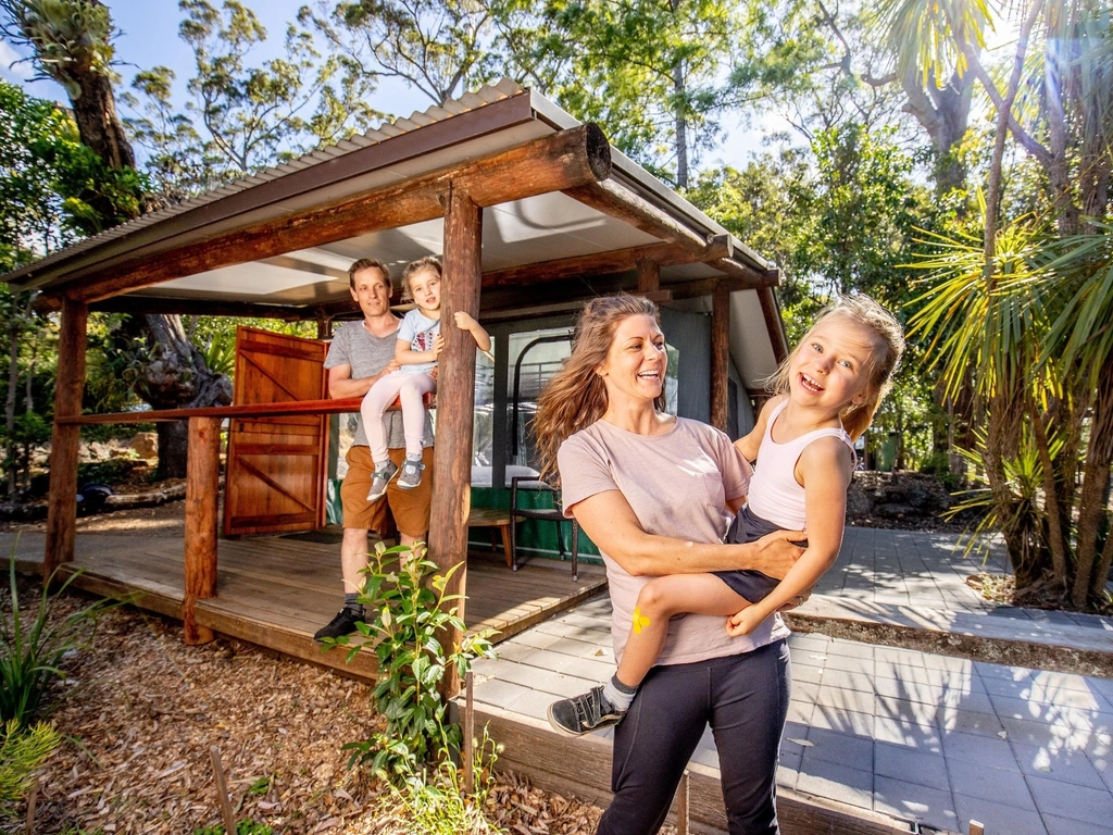 Image of a family staying in a standard safari tent