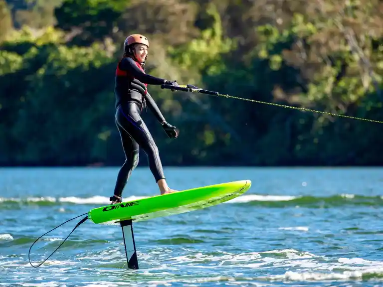 A beginner learning how to foil surf with Foiling Australia