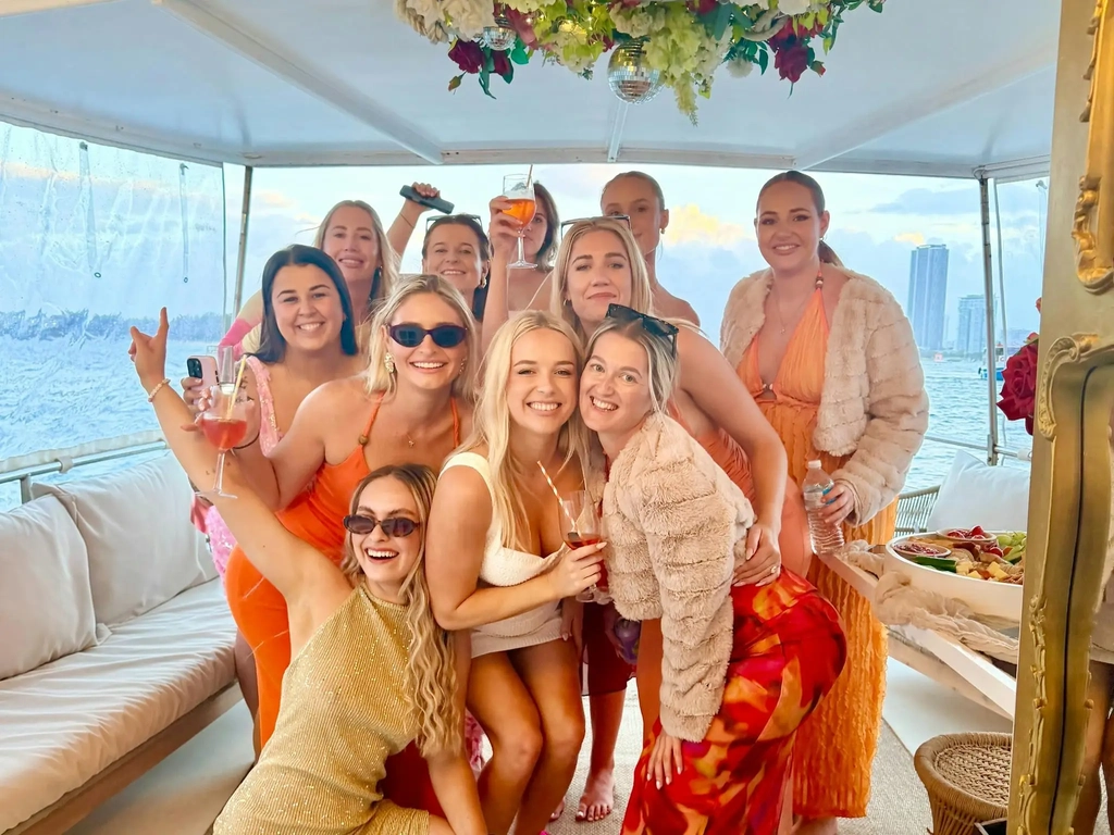Group of friends celebrating aboard Rosie Boat Charters on the Gold Coast Broadwater