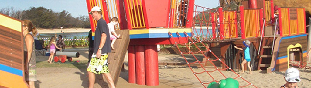 Children playing on gym equipment at the Palm Beach parklands