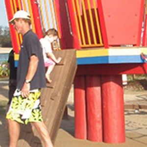 Children playing on gym equipment at the Palm Beach parklands