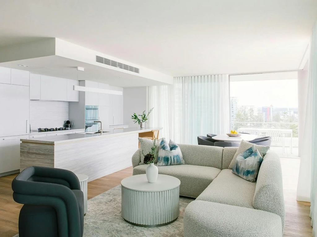 Spacious Kirra Point apartment with gourmet kitchen, coastal lounge, and balcony park views.
