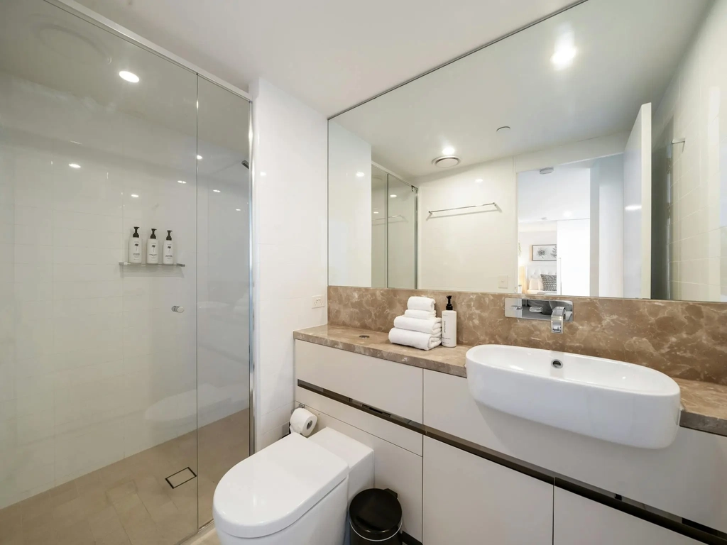 Second bathroom with a walk-in shower and vanity