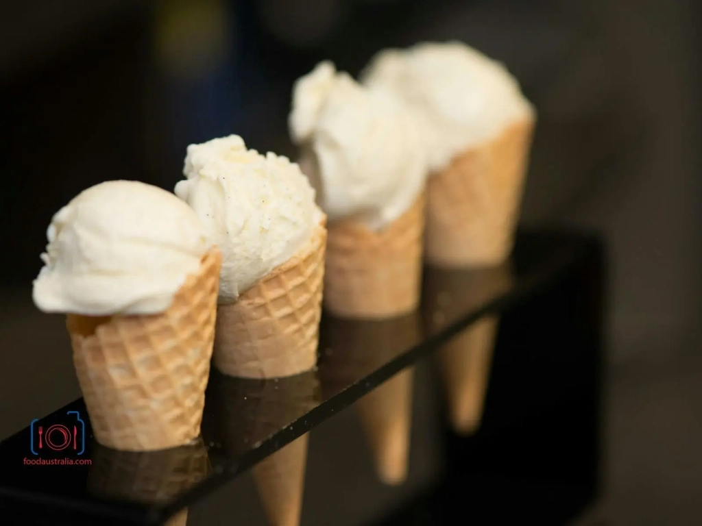 ice cream in cones positioned in a line