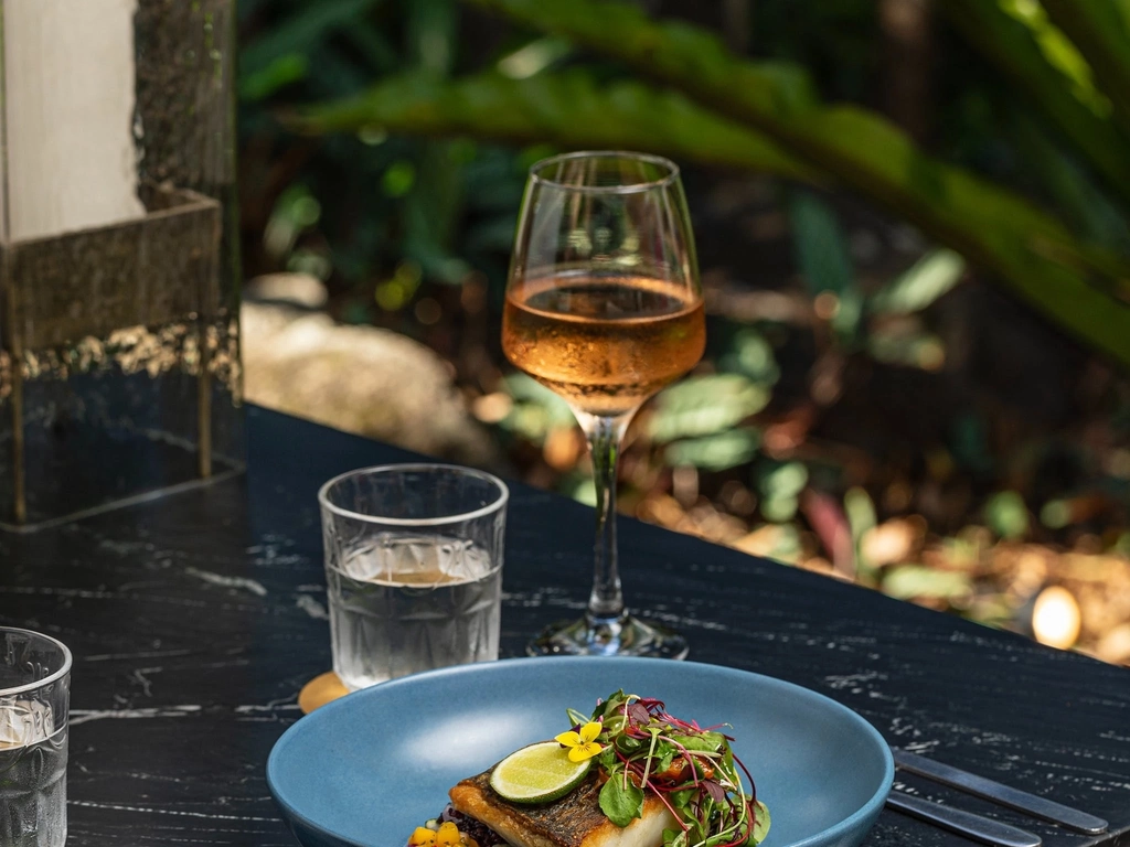 Rainforest Restaurant table with rose and barramundi
