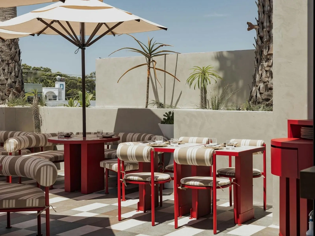 Sueno rooftop tables with open umbrella