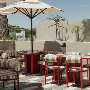 Sueno rooftop tables with open umbrella