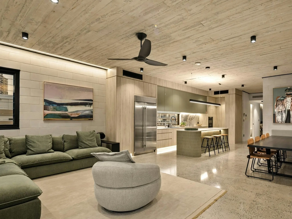 Open plan living room, kitchen island and dining table on one level