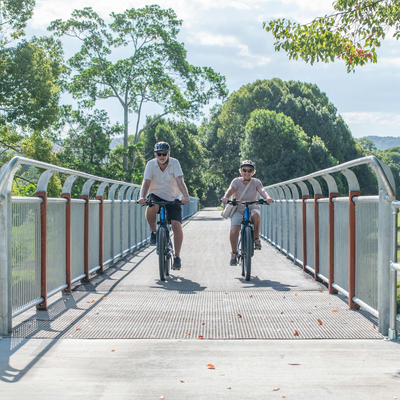 Rider crossing the longest bridge on the Northern Rivers Rail Trail with Better By Bike