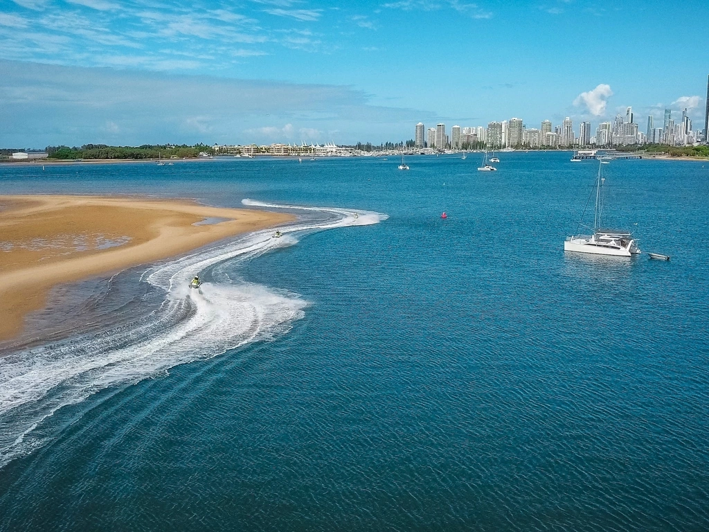 Skis riding around a sandbar on the Gold Coast