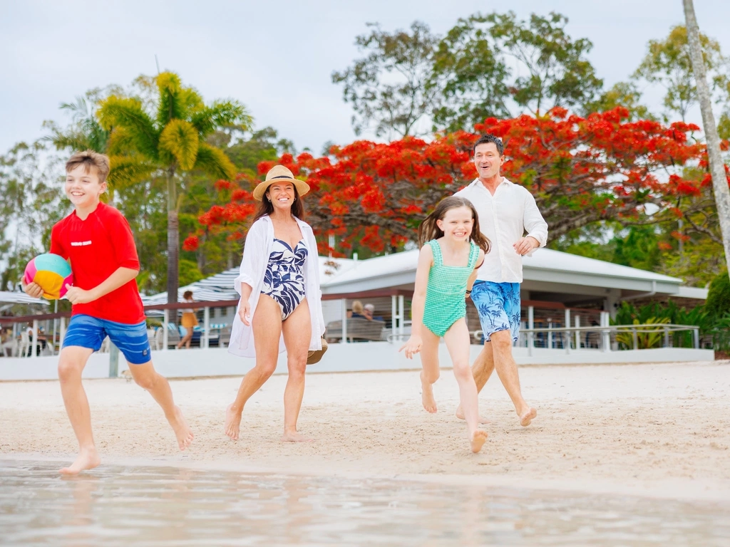 Family enjoying the beach lagoon