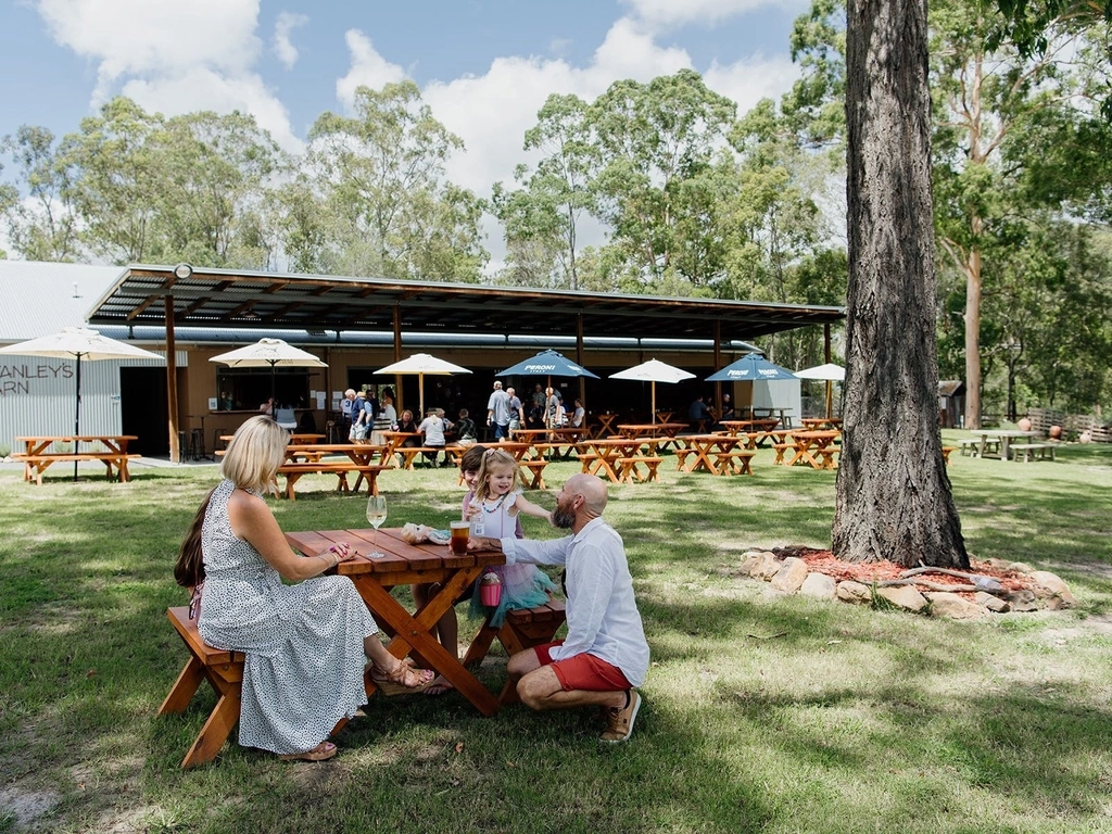 Family enjoying a beverage at Stanleys Barn