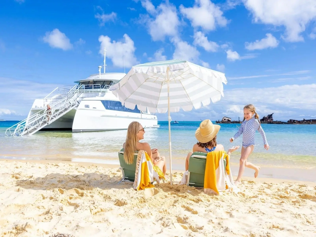 A scenic view of Moreton Island's white sandy beaches and clear turquoise waters