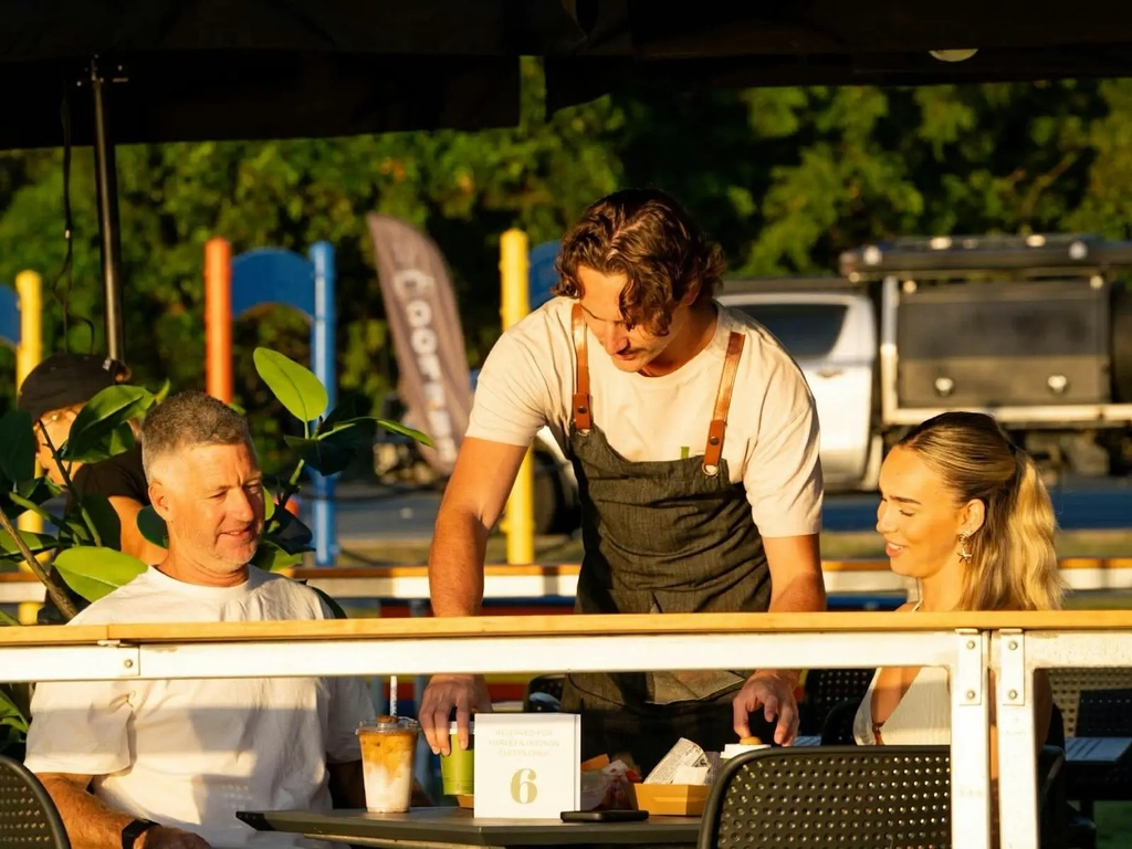 Harley & Hudson staff serving the customers at their table