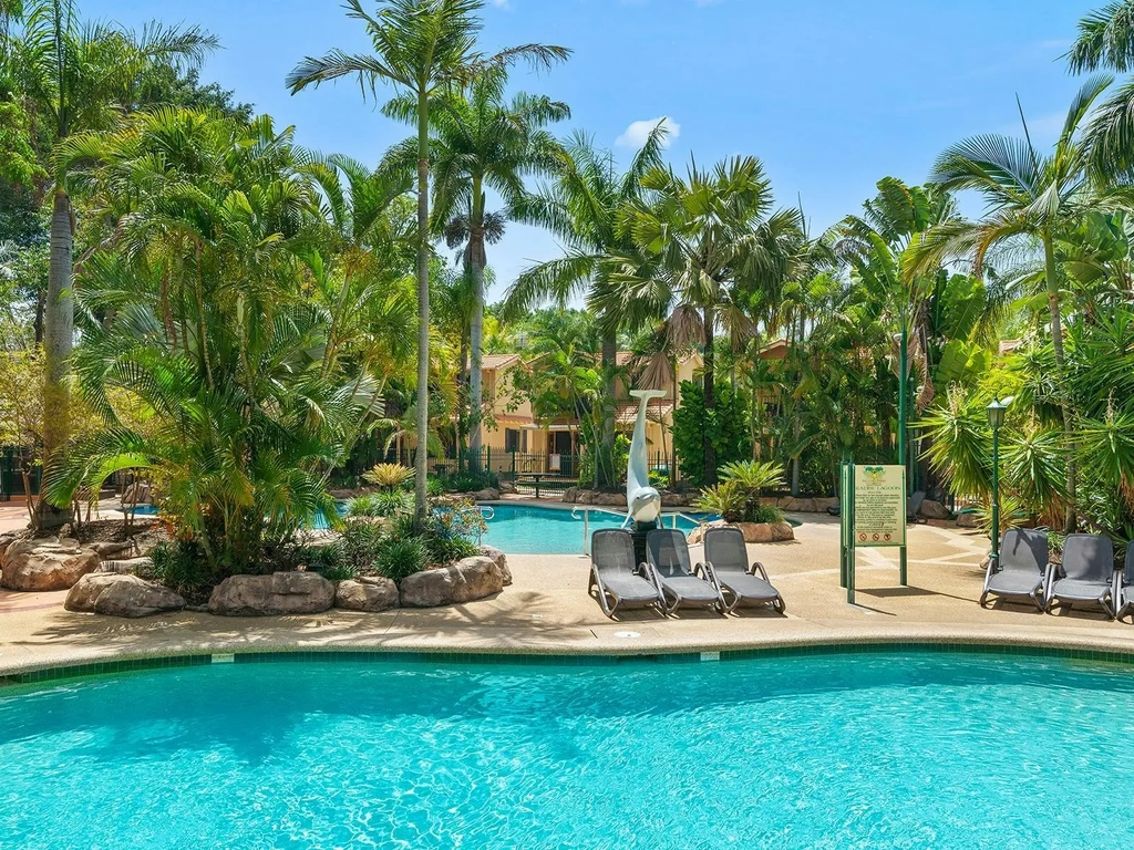 Two beautiful blue pools surrounded by lush vegetation and shade.