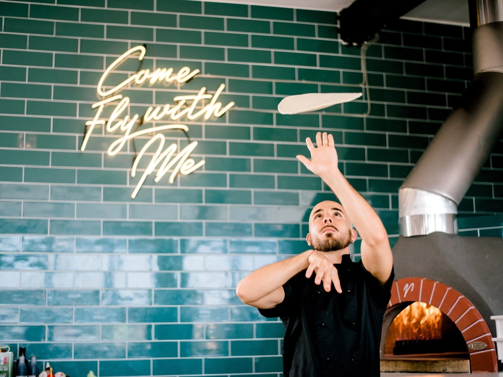 Chef Stefano hand crafting traditional Italian pizzas