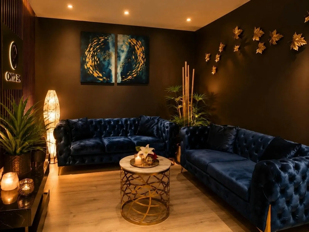 Luxury lounge area with dark blue sofas at Gold Coast Massage and Day Spa in Southport